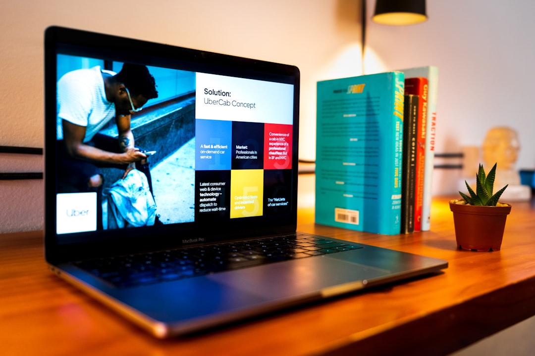 black-laptop-computer-on-brown-wooden-table-tsbg-h3pc-g